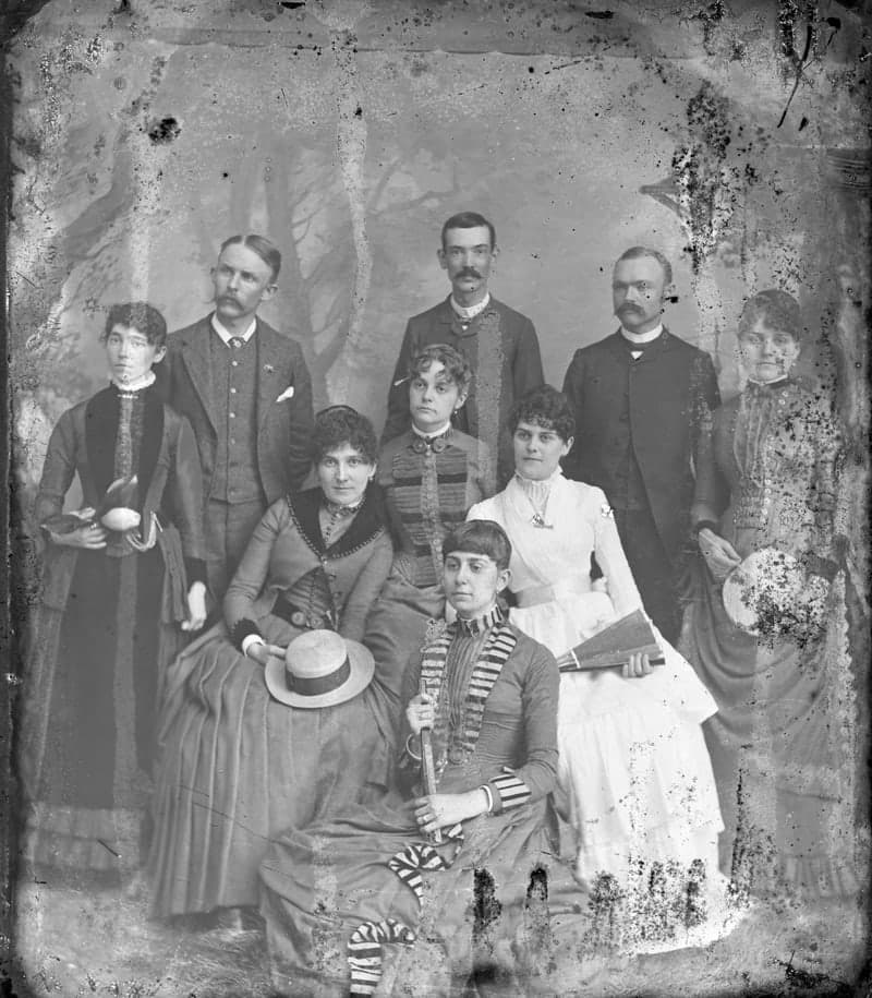 Original 1880s family group portrait covered in spots, stains and scratches