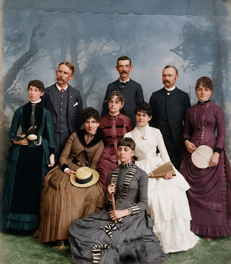 The same 1880s family group, with the damage repaired and colorized with AI
