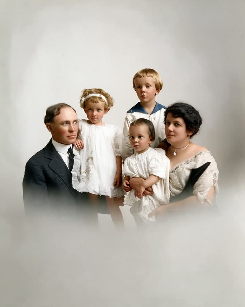 The same family portrait, repaired and colorized with AI